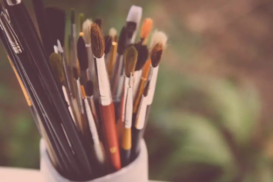 Brushes standing upright in a jar